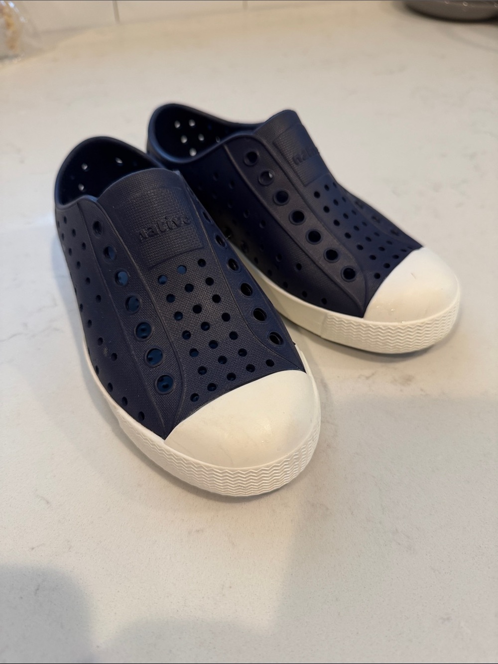 Native Navy Slip-On Sneakers with White Toe Caps
